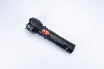 battery-powered flashlight on a white background - obrazy, fototapety, plakaty