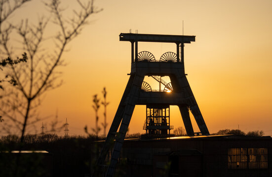 Silhouette of mining headframe, sunset