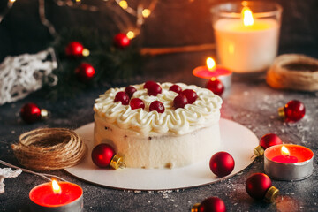 Christmas cake. Delicious cake with winter decor. Lingonberry cake on the table 