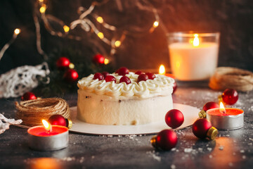 Christmas cake. Delicious cake with winter decor. Lingonberry cake on the table 