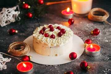 Christmas cake. Delicious cake with winter decor. Lingonberry cake on the table 