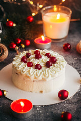 Fototapeta na wymiar Christmas cake. Delicious cake with winter decor. Lingonberry cake on the table 