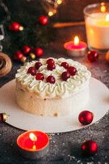 Christmas cake. Delicious cake with winter decor. Lingonberry cake on the table 