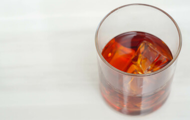 Excellent whisky served with ice cubes in a glass of Old fashioned type