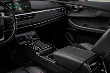Fototapeta na wymiar Car interior console close up view. Gear stick with multimedia console.