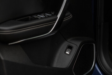 Obraz na płótnie Canvas Car trunk open button. Electric trunk switch controller. Car trunk electric lock button on the door.
