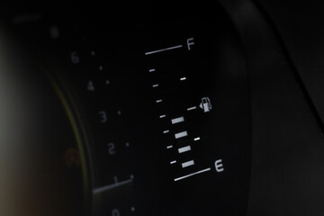 Fuel gauge close up. Car fuel dashboard details.