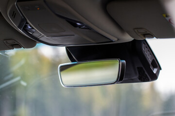 The rear view mirror inside the car.