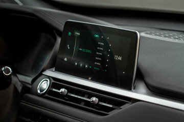 Fototapeta na wymiar Digital car radio. Modern car radio in car. Smart multimedia touchscreen system.