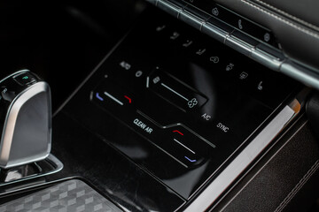 Digital control panel car air conditioner dashboard. Modern car interior conditioning buttons inside a car close up view.