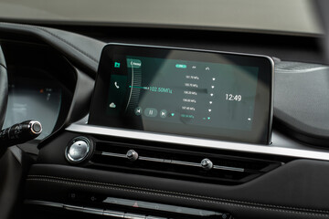Fototapeta na wymiar Digital car radio. Modern car radio in car. Smart multimedia touchscreen system.
