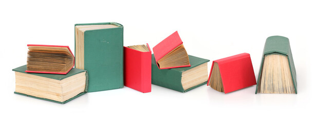 Red and green books isolated on a white background © Elena