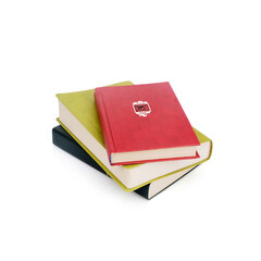 Stacks of red, black and green books isolated on a white background