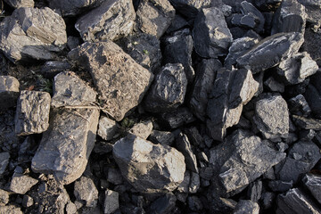 The natural texture of coal for the background is the coal industry. Frost-covered coal, carbon-based fossil energy sources