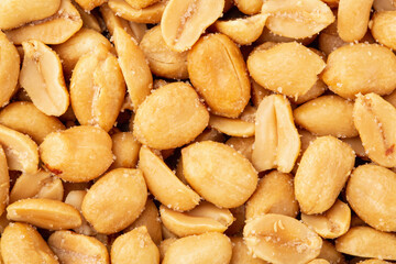 Salted peanuts as a background closeup, top view, flat lay	