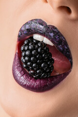 Beautiful young woman with unusual makeup and blackberry, closeup
