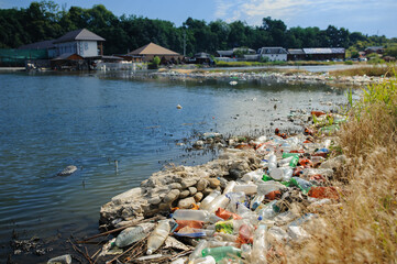 The lake and the shore are littered with garbage