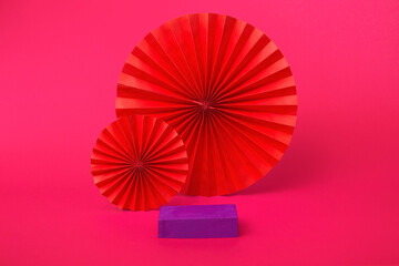 A very peri geometric podium to showcase cosmetic products on a pink background. Showcase abstract background closeup