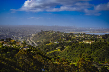 2021-12-26 VIEW OF LA JOLLA, MISSION BEACH AND DOWNTOWN SAN DIEGO FROM MT SOLEDAD WITH A LIGHT MORNING FOG AND BLUE SKY