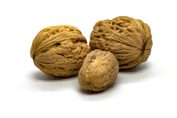 Three walnuts on a white background