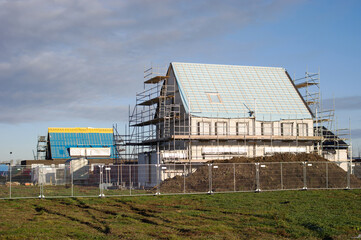 House under construction with in the background another house under construction in Emmeloord in the Netherlands