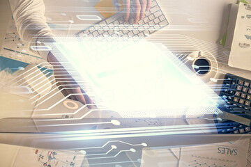 Double exposure of man's hands typing over computer keyboard and data theme hologram drawing. Top view. Technology concept.