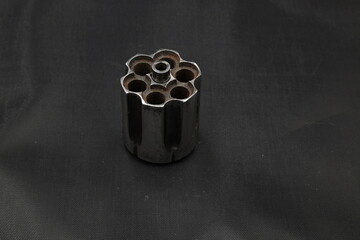 revolver cylinder on black background