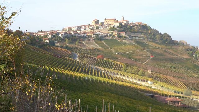 Beautiful hills and vineyards during fall season surrounding La Morra village. In the Langhe region, Cuneo, Piedmont, Italy.