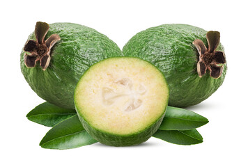 Two trropical fruit feijoa one cut in half with green leaf