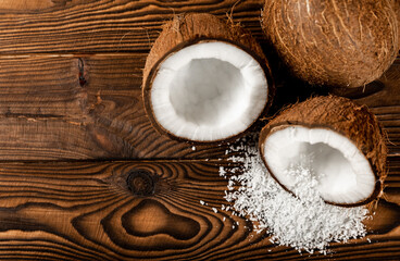 coconut flakes with coconut on a wooden background. Close-up. copy space.