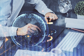 Multi exposure of man's hands holding and using a digital device and map drawing. International business concept.