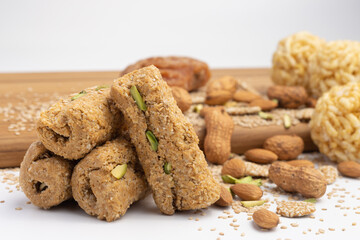 Traditional Indian sweet Mithai Gajjak Also Known As Gur Gajjak Gazak, Gachak Is Made Of Jaggery Gud til sesame seed Almonds Badam And Pistachio prepared during Makar Sankranti Lohri