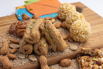 Indian traditional sweets Mithai Gajjak Gur Gajjak Gazak Gachak Made Of Jaggery Gud til sesame seed Almonds Badam And Pistachio prepared during Makar Sankranti Lohri and consumed during winters