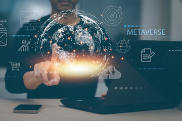 Metaverse with business concept, man using computer and touch virtual globe with financial icons future technology, business goals, online communication,graph Screen Icon of a media screen,big data