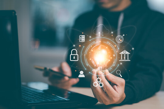 thinking and creative concept, Close up the light bulb and man working on the desk, Creativity, and innovation are keys to success,  new idea and innovation with Brain and light bulbs,big data