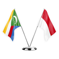 Two table flags isolated on white background 3d illustration, comoros and monaco