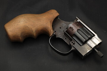 A part of revolver on black background