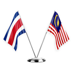 Two table flags isolated on white background 3d illustration, costa rica and malaysia