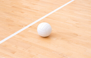 Volleyball ball and white line on wooden court. Horizontal education and sport poster, greeting cards, headers, website