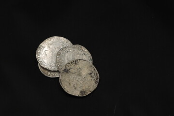 Medieval european silver coins on black background