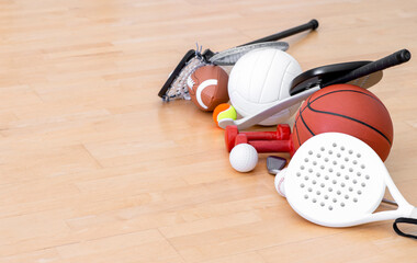 Sports equipment, rackets and balls on hardwood court floor. Horizontal education and sport poster,...