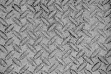 iron floor in the bus. gray metal background. light corrugated texture. steel industry concept