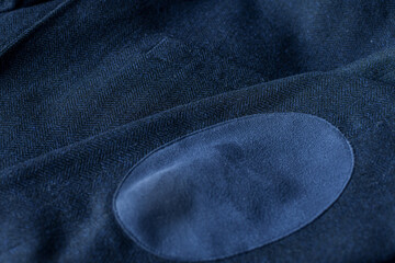 Detail of men casual outwear, blue woolen blazer, with a pocket and sleeve fragment.