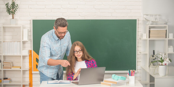 Serious Teen Girl And Teacher Man In High School With Pc At Blackboard, Childhood