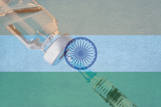 Corona virus vaccine and India flag , Vaccines and syringes on a light blue background