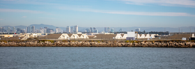 Fototapeta na wymiar The Conventional Explosive and Ammunition Storage Farm at the San Diego Helicopter Air Base on the Coronado bay as Seen from a Boat with Concrete Bunkers 