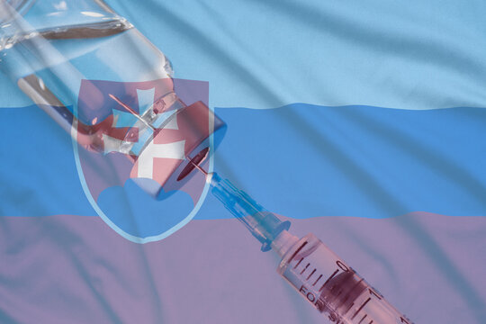 Corona Virus Vaccine And Slovakia Flag, Vaccines And Syringes On A Light Blue Background