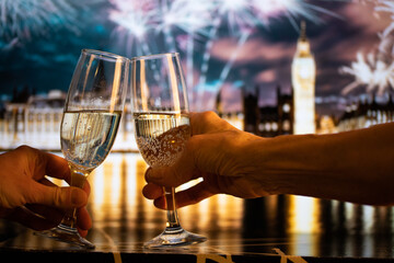 champagne glasses and Big Ben in background New Year's eve in London