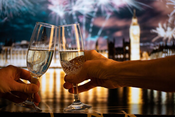 Fototapeta na wymiar champagne glasses and Big Ben in background New Year's eve in London