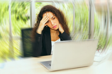 Businesswoman experiences dizziness, headache, migraine lightheadedness and dizziness while sitting...